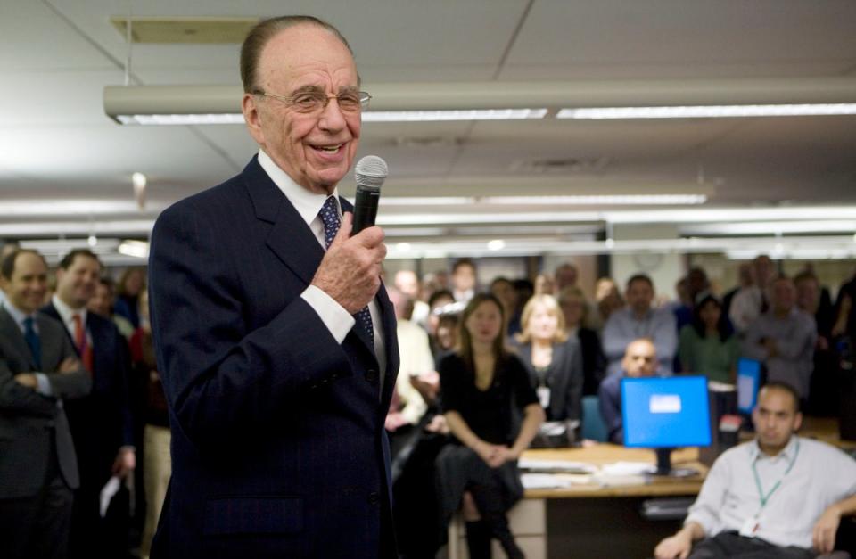 Rupert Murdoch, Chairman and CEO of News Corp, addresses a crowded Wall Street Journal newsroom in New York (AP)