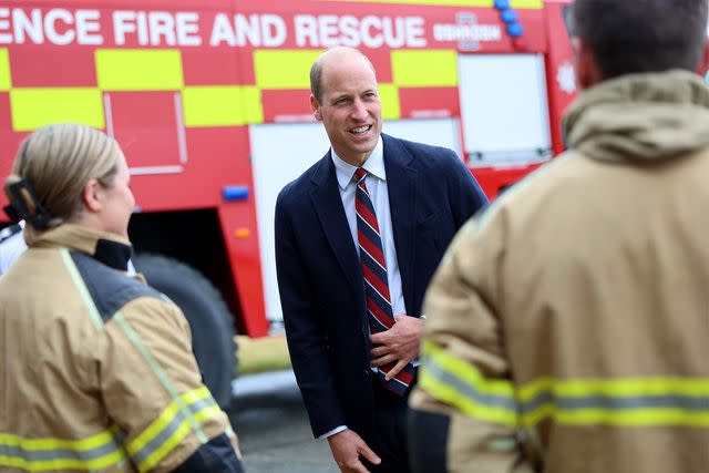 <p>Chris Jackson/Getty</p> Prince William speaks with personnel following a simulated fire response exercise at RAF Valley on July 9, 2024.