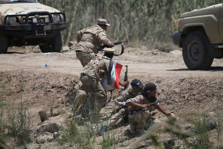 Iraqi security forces clash with Islamic State militants near Falluja, Iraq, May 25, 2016. REUTERS/Thaier Al-Sudani