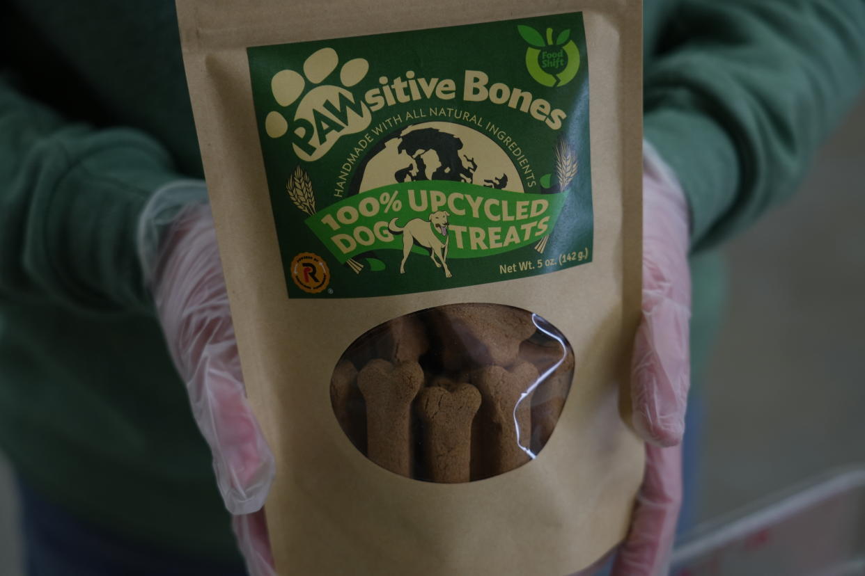 A package of Pawsitive Bones, a dog treat, produced by Food Shift, made of ingredients that are usually discarded, is shown Tuesday, Sept. 13, 2022 in Alameda, California. "Best before” labels are coming under scrutiny as concerns about food waste grow around the world. Manufacturers have used the labels for decades to estimate peak freshness. But “best before” labels have nothing to do with safety, and some worry they encourage consumers to throw away food that’s perfectly fine to eat. (AP Photo/Terry Chea)