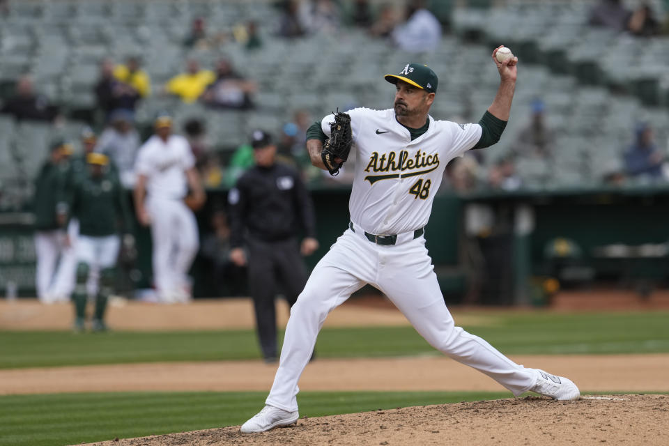 Oakland Athletics pitcher T.J. McFarland throws to a Boston Red Sox batter during the eighth inning of a baseball game Wednesday, April 3, 2024, in Oakland, Calif. (AP Photo/Godofredo A. Vásquez)