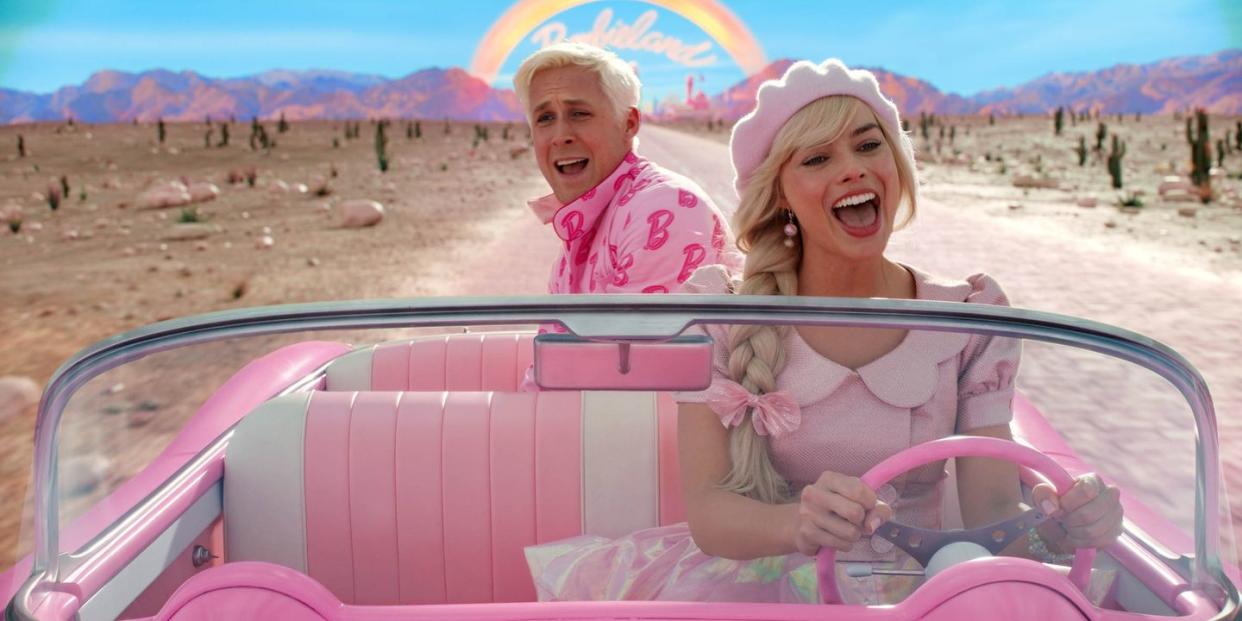 barbie and ken drive in barbie's pink car in a scene from barbie