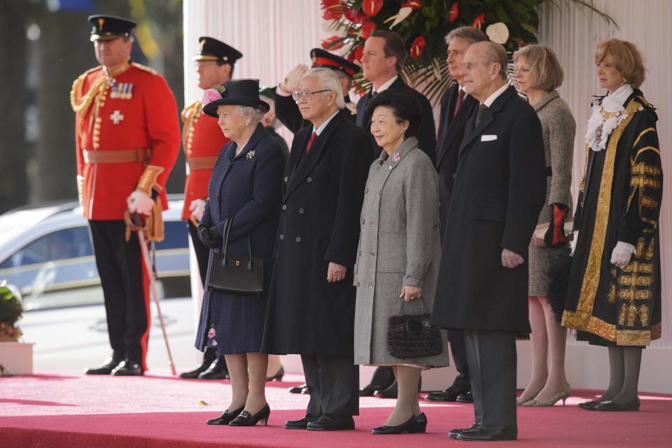 Britain's Queen Elizabeth and Prince Philip stand with Singapore's President Tony Tan and his wife Mary during the ceremonial welcome ceremony at Horse Guards Parade, in London