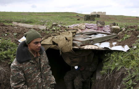 Soldiers of the self-defense army of Nagorno-Karabakh gather at their positions in Martakert province, which according to Armenian media was affected by clashes over the breakaway Nagorno-Karabakh region, April 4, 2016. REUTERS/Vahan Stepanyan/PAN Photo