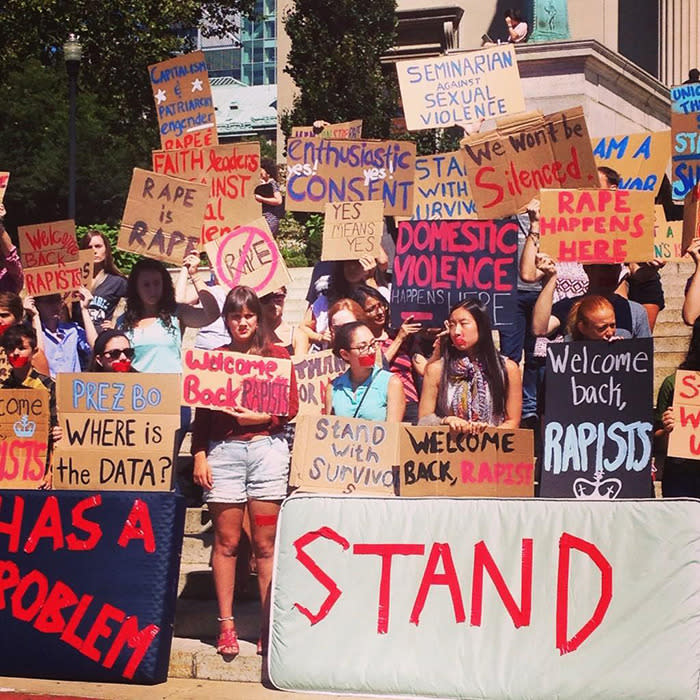 Students carry mattresses in support of Columbia student raped on campus.