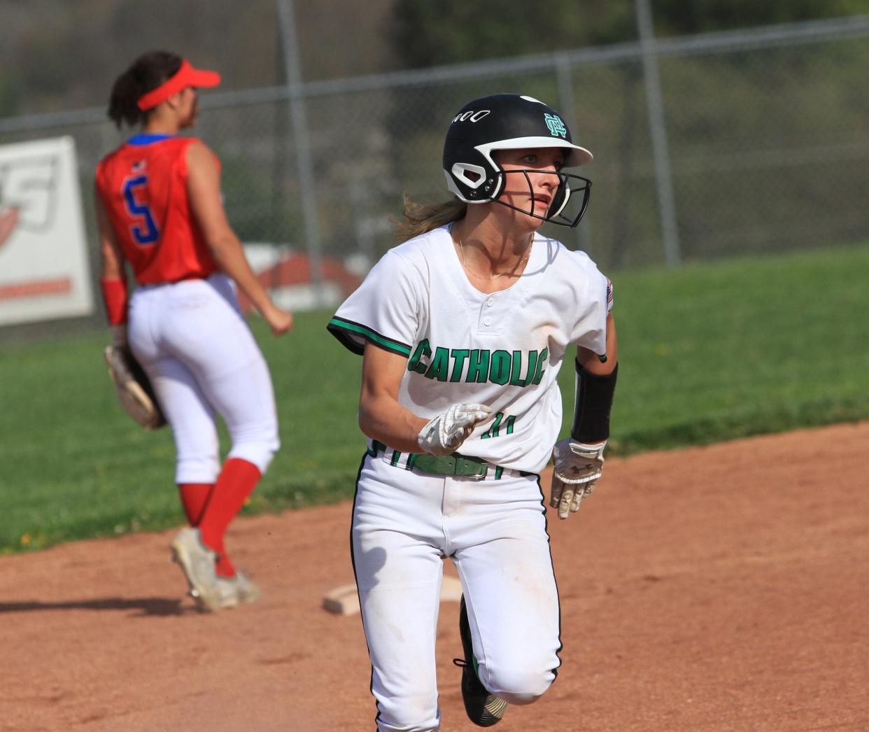 Newark Catholic's Kylie Gibson heads to third base against Licking Valley on Tuesday.