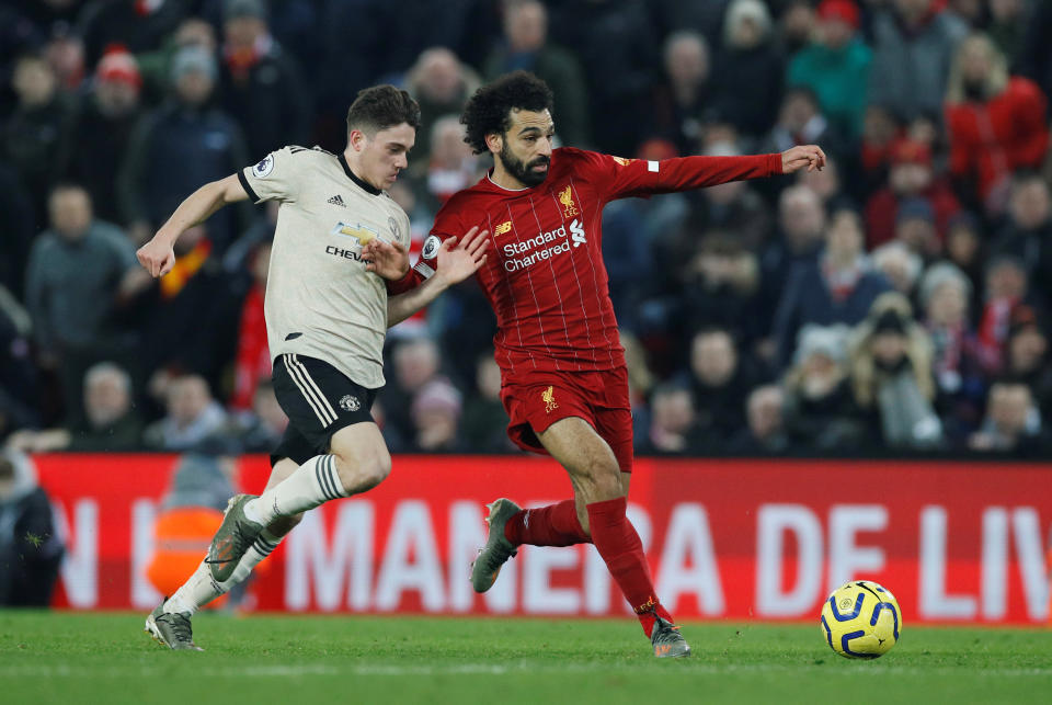 Liverpool's Mohamed Salah (right) battles for the ball with Manchester United's Daniel James.