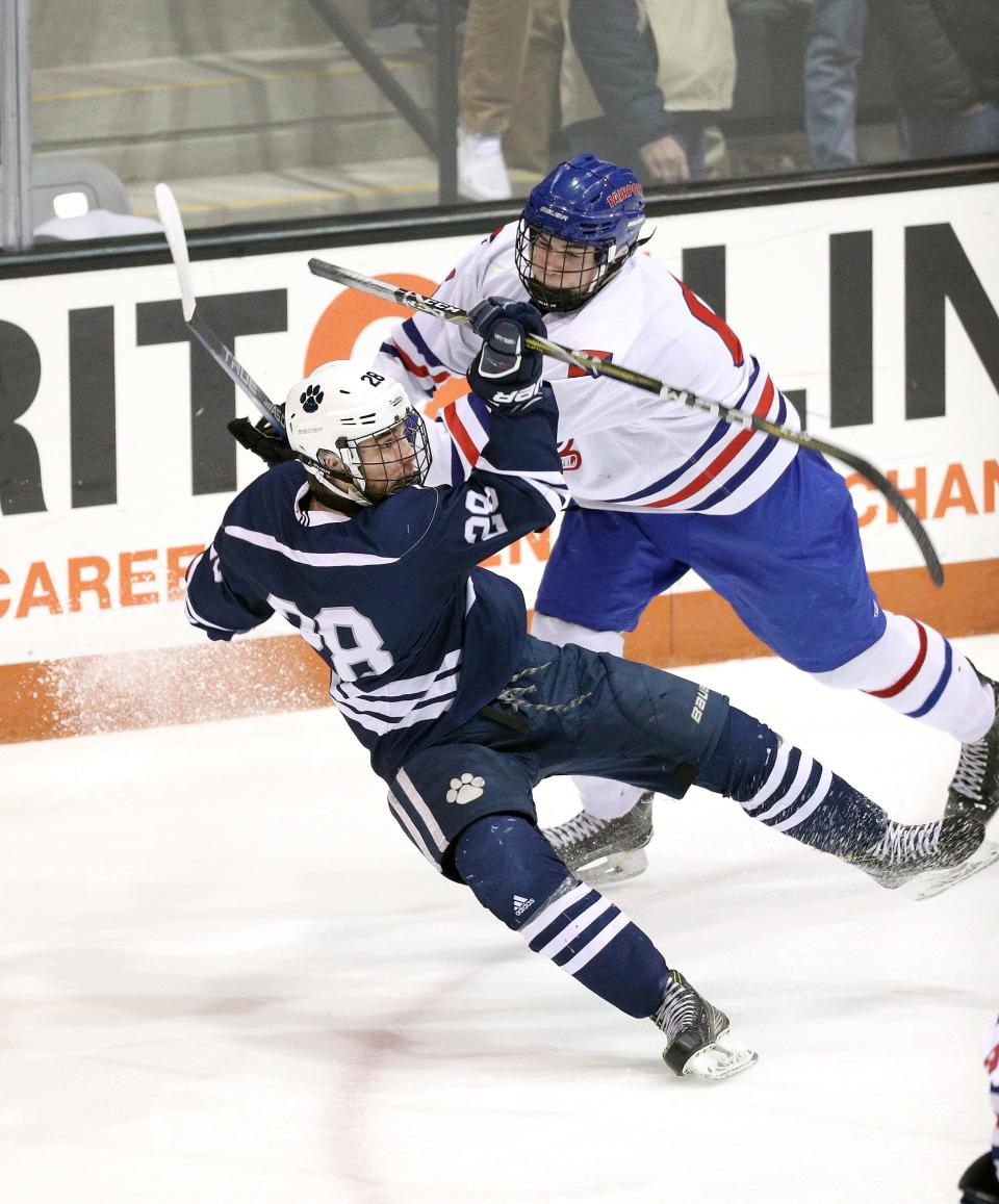 Fairport's Hunter McDonald, right, checks Pittsford's Shawn Alexander during the 2019 Section V Class A championship.