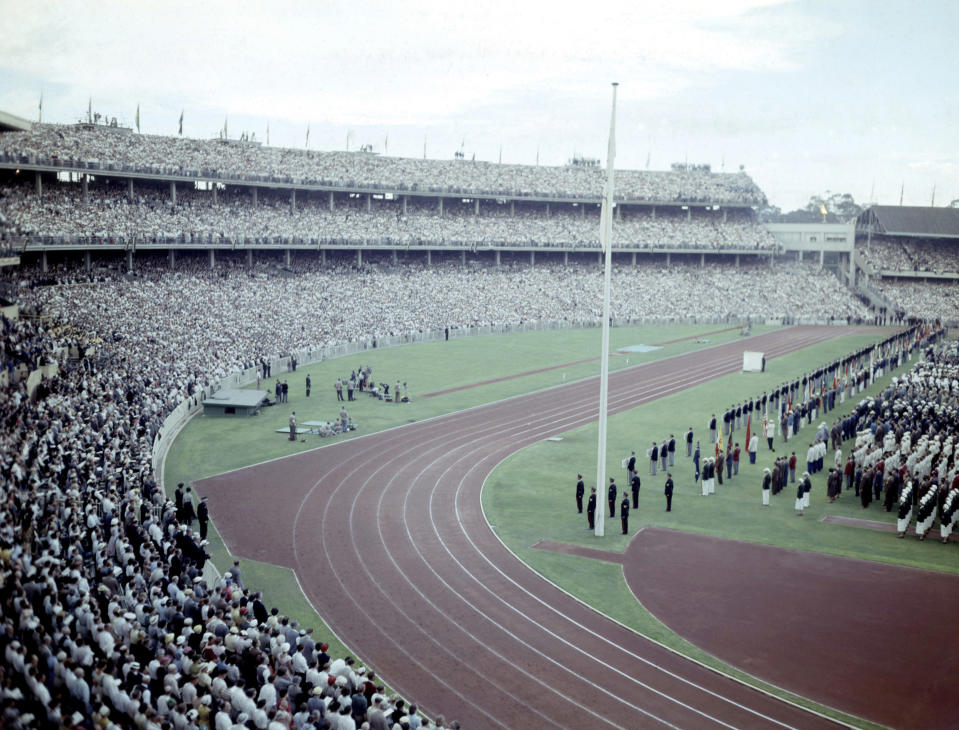 FILE - In this Nov. 22, 1956, file photo, a general view shows crowds and athletes in the Olympic Stadium, in Melbourne, Australia, during the opening ceremony of XVI Olympic Games. An Australian push to host the 2032 Olympics was elevated overnight to the status of preferred bid, and the people of Brisbane and southeast Queensland state woke up to the news Thursday, Feb. 25, 2021 (AP Photo, File)