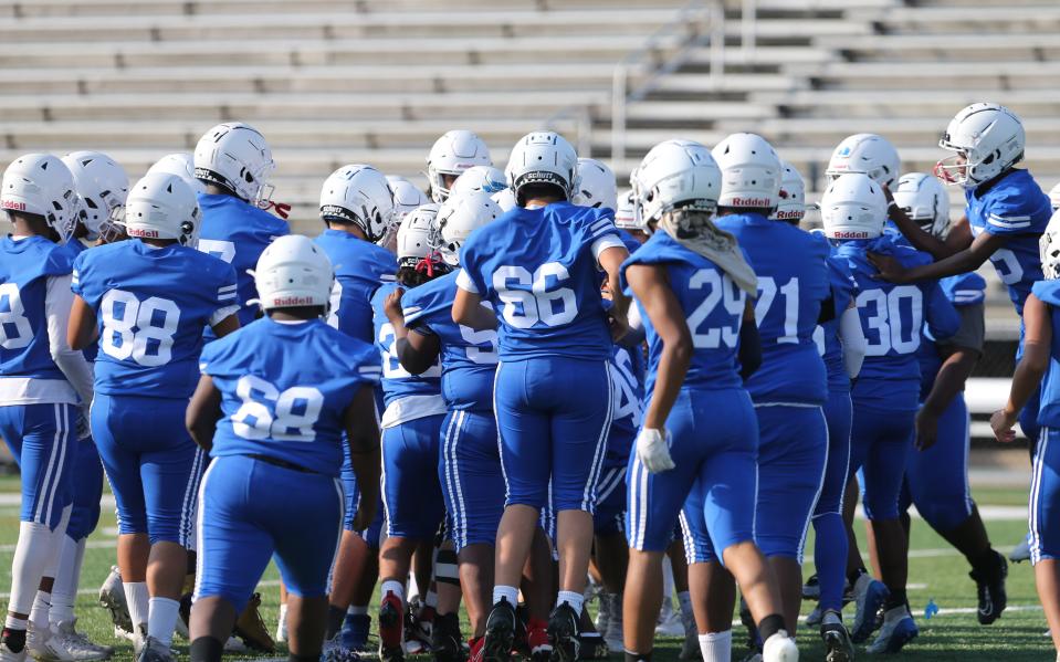 The South Bend Adams team assembles before the Adams vs. Culver Academy football game Friday, Aug. 18, 2023, at School Field in South Bend.