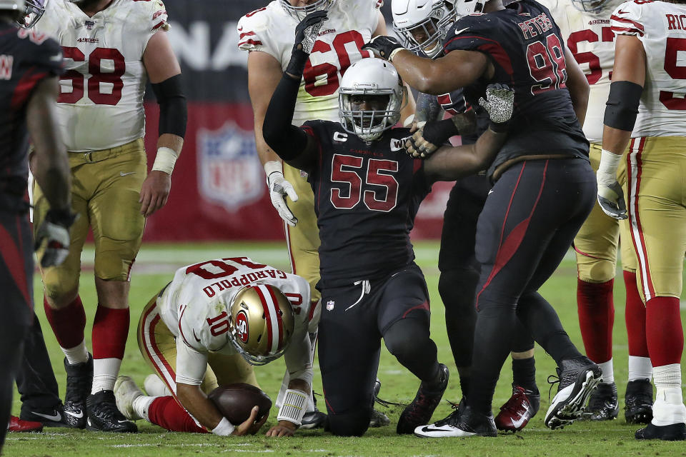 Arizona Cardinals linebacker Chandler Jones (55) celebrates his sack of San Francisco 49ers quarterback Jimmy Garoppolo (10) during the second half of an NFL football game, Thursday, Oct. 31, 2019, in Glendale, Ariz. (AP Photo/Ross D. Franklin)