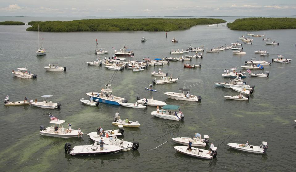 Participants take part in a protest over the closure of Everglades National Park waters for fishing as part of the U.S. government shutdown, near Islamorada, Florida in this October 9, 2013 handout photo. Fishing guides say they depend on income from use of the park's waters which have been closed since October 1. (REUTERS/Andy Newman/Florida Keys News Bureau)