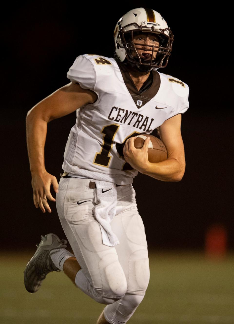 Central’s Boston Steers (14) runs the ball as the Central Bears  play the Memorial Tigers at Enlow Field in Evansville, Ind., Friday evening, Sept. 2, 2022. 