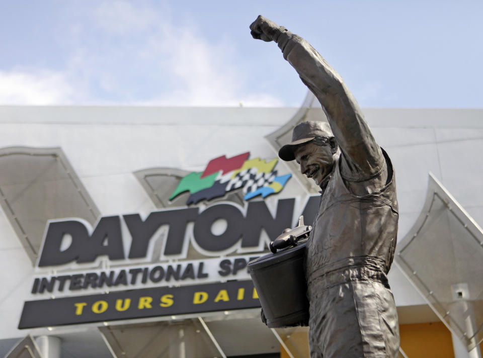 FILE - A statue of Dale Earnhardt rises above an entrance at Daytona International Speedway in Daytona Beach, Fla., Feb. 16, 2011. To mark NASCAR’s 75th season, The Associated Press interviewed 12 key contributors to the industry on multiple topics. According to the survey, Dale Earnhardt's death in the 2001 Daytona 500 was picked as NASCAR's most pivotal moment. (AP Photo/Lynne Sladky, File)