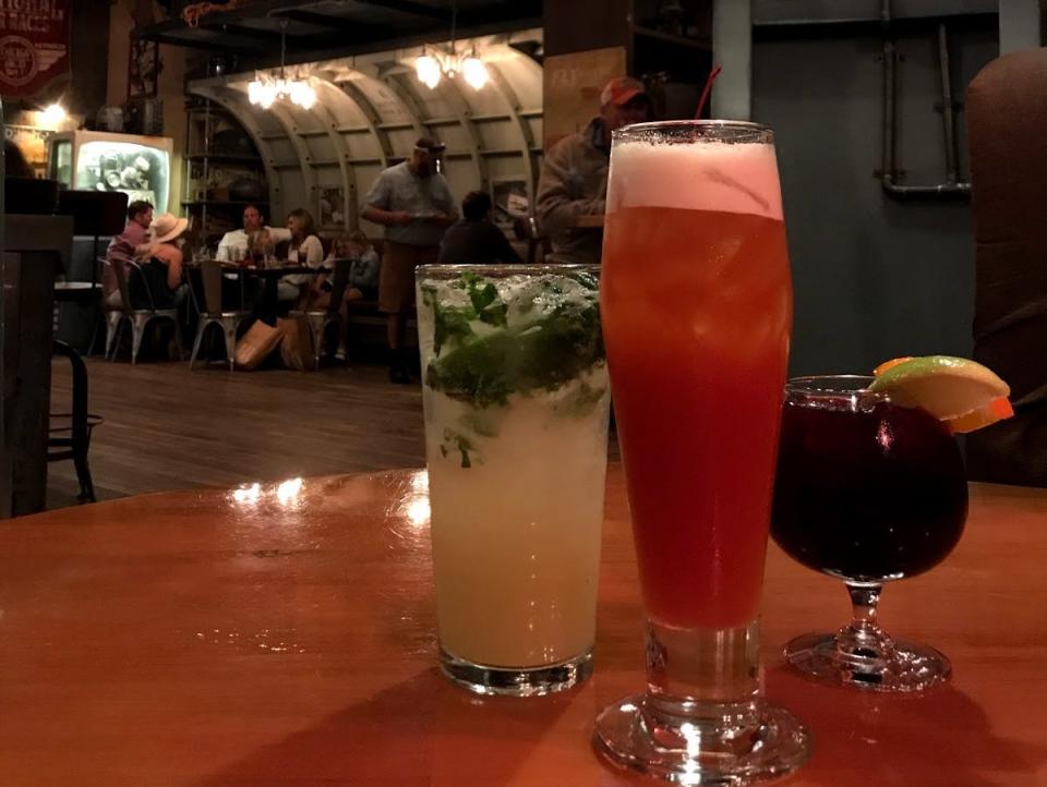 drinks on a table inside jock lindsey's hanger bar at disney springs