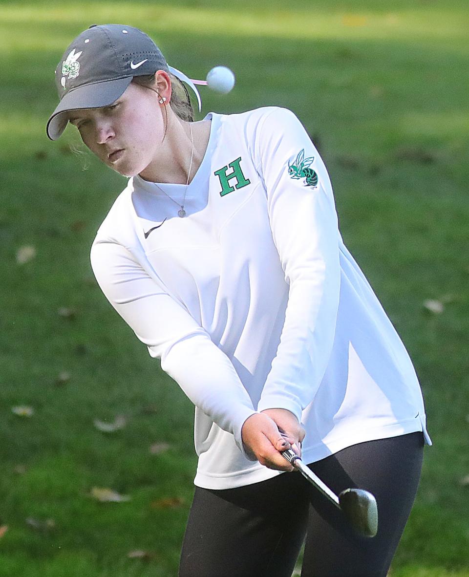 Highland senior Isabella Goyette hits a chip shot to the No. 7 green during the Division I girls golf district tournament Oct. 1, at Brookledge Golf Club in Cuyahoga Falls.