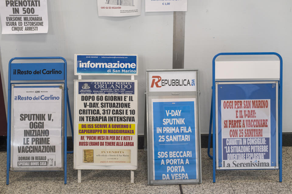 SAN MARINO, ITALY - FEBRUARY 25: Newsstand bulletin boards with newspapers about Vaccination Day in the Republic of San Marino with the Russian vaccine Sputnik on February 25, 2021 in San Marino, Italy. The vaccination campaign for Covid-19 with Russian Sputnik vaccine for 25 healthcare workers started today. (Photo by Michele Lapini/Getty Images)