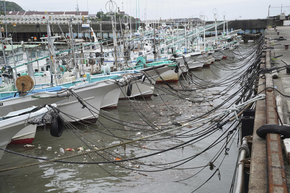 Fishing boats are anchored at a port as Typhoon Hagibis approaches in town of Kiho, Mie prefecture, Japan Friday, Oct. 11, 2019. A powerful typhoon is advancing toward the Tokyo area, where torrential rains are expected this weekend. (AP Photo/Toru Hanai)