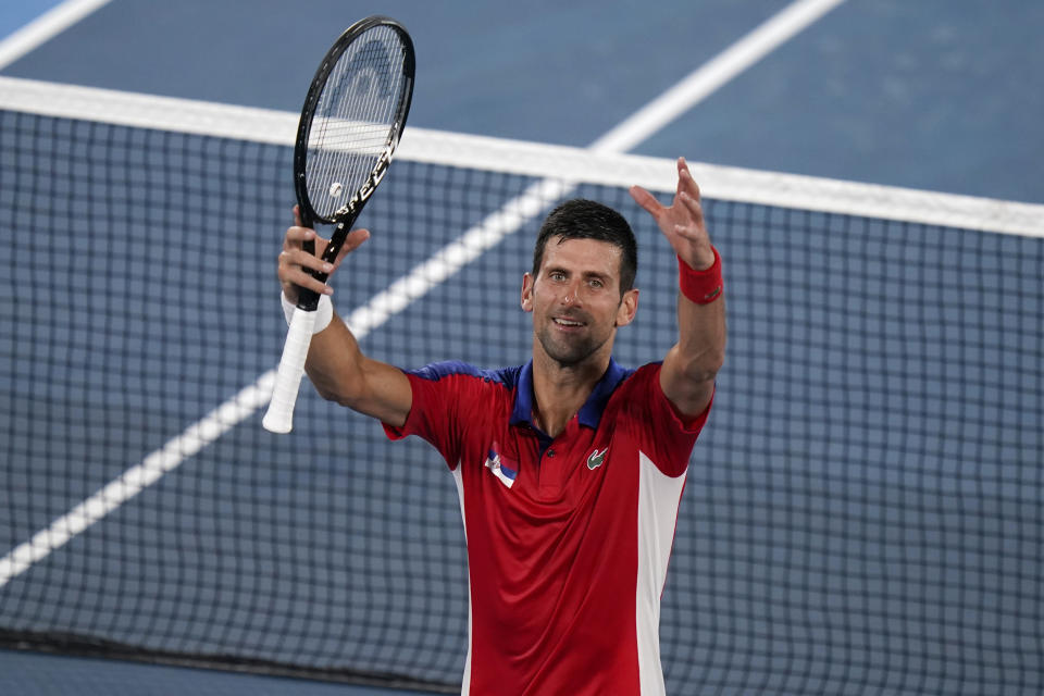 Novak Djokovic, of Serbia, celebrates after defeating Kei Nishikori, of Japan, during the quarterfinals of the tennis competition at the 2020 Summer Olympics, Thursday, July 29, 2021, in Tokyo, Japan. (AP Photo/Seth Wenig)