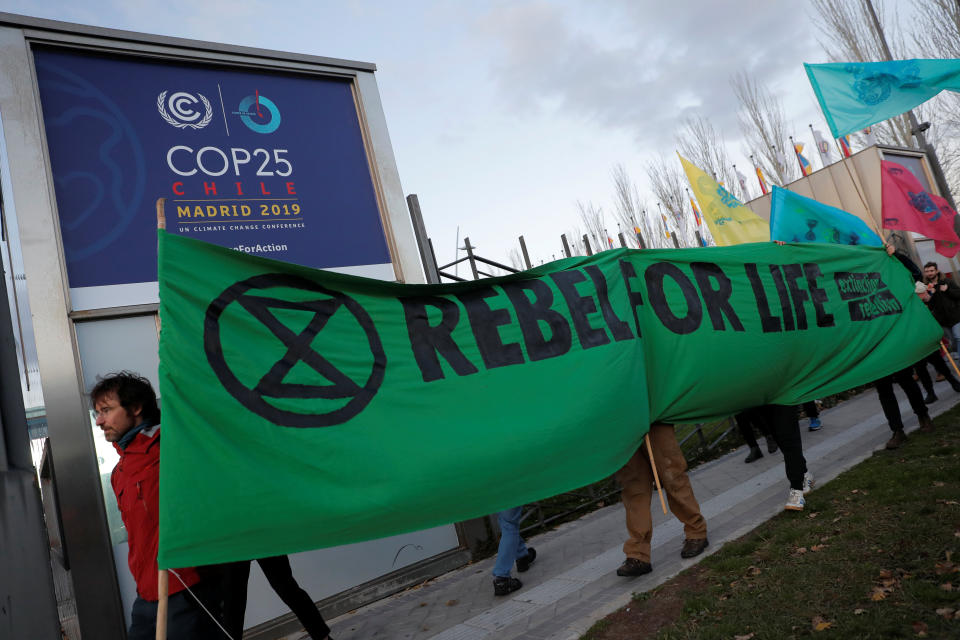 Members of the Extinction Rebellion group stage a protest Monday outside the venue of the United Nations climate change conference in Madrid. (Photo: Juan Medina / Reuters)