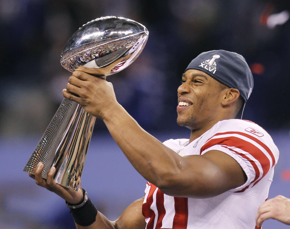 Wide receiver Victor Cruz (80) of the New York Giants holds the championship  trophy at the end of Super Bowl XLVI on Sunday, February 5, 2012, at Lucas  Oil Stadium in Indianapolis