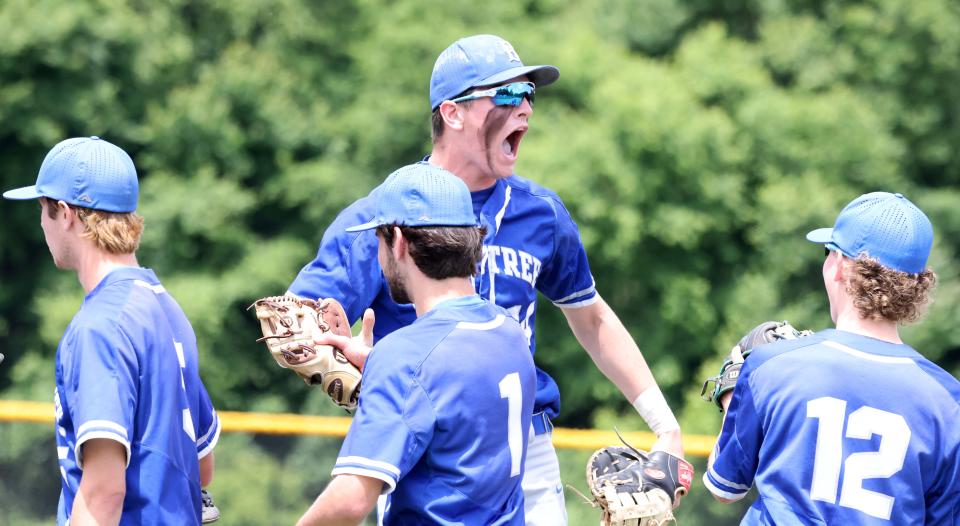 Braintree's Jack Fitzgerald, top, gets his teammates  pumped-up before a game versus Taunton, on Saturday, June 11, 2022.