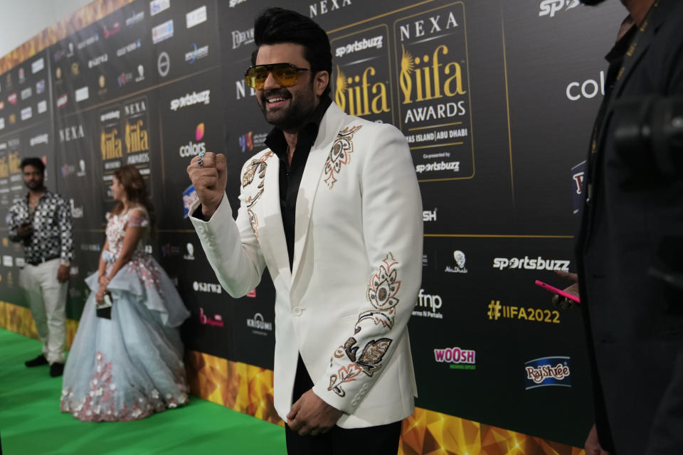 Indian actor and presenter Manish Paul gestures on the green carpet ahead of the 22nd International Indian Film Academy (IIFA) awards in Abu Dhabi, United Arab Emirates, Friday, June 3, 2021. (AP Photo/Kamran Jebreili)