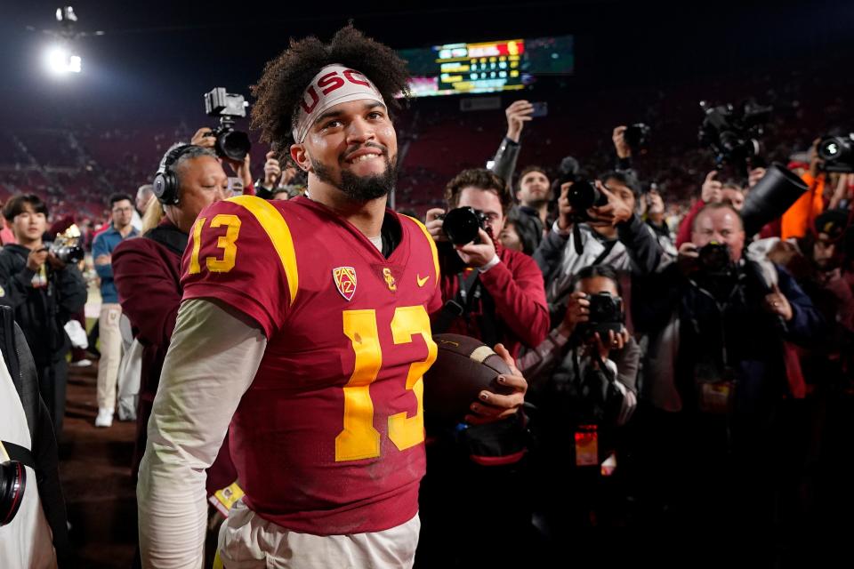 FILE - Southern California quarterback Caleb Williams smiles after USC defeated Notre Dame 38-27 in an NCAA college football game Saturday, Nov. 26, 2022, in Los Angeles. Southern California quarterback Caleb Williams was named the AP Player of the Year in college football, Thursday, Dec. 8, 2022. (AP Photo/Mark J. Terrill, File)