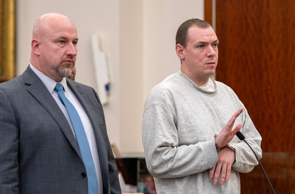 Kevin D. Donnellan, right, pleads guilty to manslaughter in Worcester Superior Court on Friday. Richard J. Farrel Jr., left, was his lawyer.