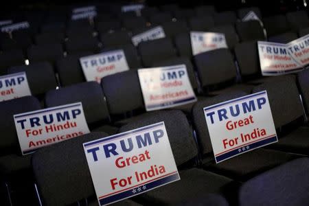 Signs are ready for attendees to hold during Republican presidential nominee Donald Trump's remarks at a Bollywood-themed charity concert put on by the Republican Hindu Coalition in Edison, New Jersey, U.S. October 15, 2016. REUTERS/Jonathan Ernst