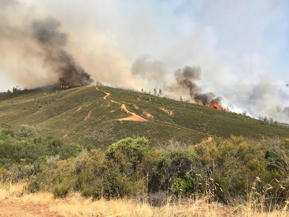 Wind-driven wildfires threatened homes in Northern California