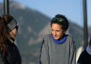 Olympic hopeful Maggie Montoya is shown as she trains with fellow runners at a park on the east side of Boulder, Colo., Friday, April 9, 2021. Maggie Montoya called her mom and dad to say she loved them from a conference room as she waited out the Boulder shooting ordeal. The Olympic hopeful was working in the pharmacy at the King Soopers supermarket in Colorado on March 22 when 10 people were killed in the mass shooting. (AP Photo/David Zalubowski)