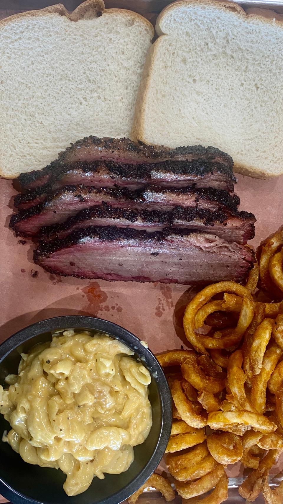 Single Tree Barbecue is most renowned for its beef brisket dish served with macaroni & cheese and curly fries or baked beans.