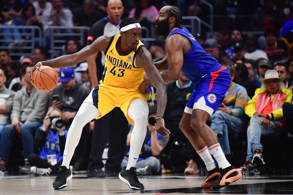 Mar 25, 2024; Los Angeles, California, USA; Indiana Pacers forward Pascal Siakam (43) moves the ball against Los Angeles Clippers guard James Harden (1) during the second half at Crypto.com Arena. Mandatory Credit: Gary A. Vasquez-USA TODAY Sports