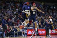 New Orleans Pelicans guard Jose Alvarado (15), right, celebrates a three point basket with New Orleans Pelicans guard Devonte' Graham in the second half of an NBA basketball game against the Denver Nuggets in New Orleans, Sunday, Dec. 4, 2022. (AP Photo/Matthew Hinton)