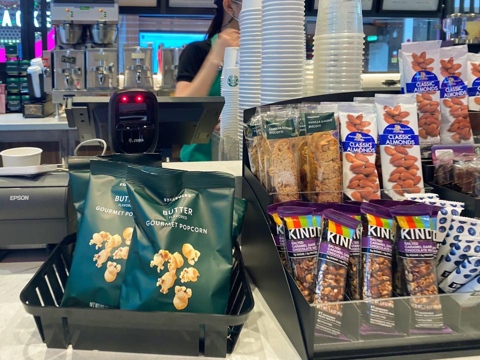 Snacks on a starbucks stand on an indoor deck on a cruise ship