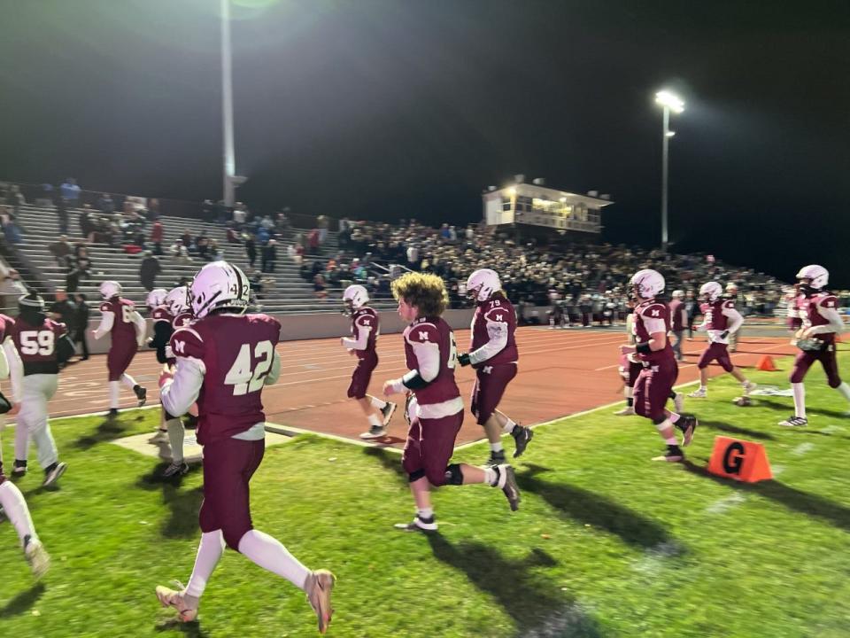 Mishawaka players head back to the locker room after warm-ups prior to Friday night's 5A regional championship game against No. 1 Fort Wayne Snider at Steele Stadium.