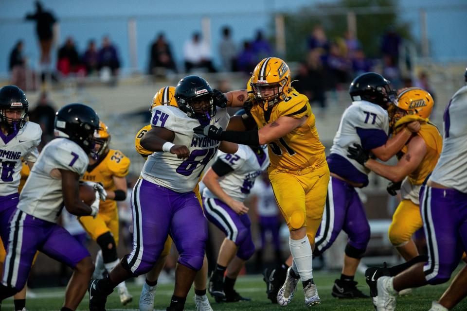 Zeeland East's Keaton Draeger looks to get past his blocker and to the rusher Friday, Sept. 15, 2023, at Zeeland Stadium.