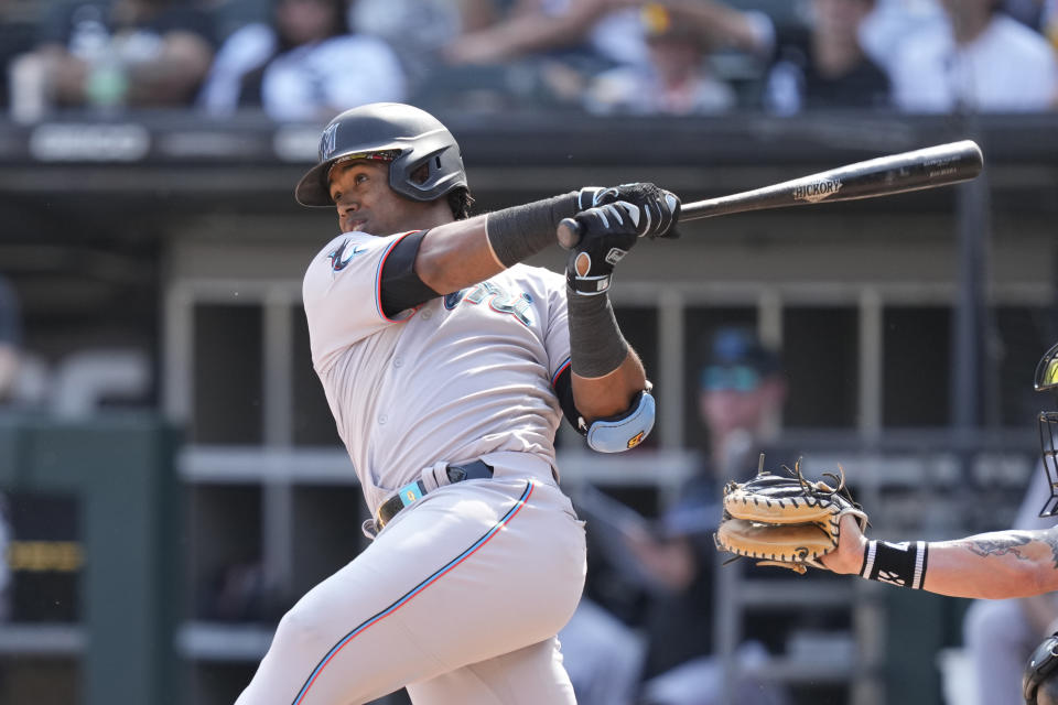 Miami Marlins' Jean Segura hits a two-run double during the ninth inning of a baseball game against the Chicago White Sox Saturday, June 10, 2023, in Chicago. The Marlins won 5-1. (AP Photo/Charles Rex Arbogast)