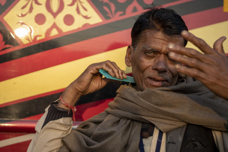 An Indian pilgrim combs his hair as he prepares to embark on a visit to the sacred Pashupatinath temple in Kathmandu, Nepal, Tuesday, Jan. 9, 2024. The centuries-old temple is one of the most important pilgrimage sites in Asia for Hindus. Nepal and India are the world’s two Hindu-majority nations and share a strong religious affinity. Every year, millions of Nepalese and Indians visit Hindu shrines in both countries to pray for success and the well-being of their loved ones. (AP Photo/Niranjan Shrestha)