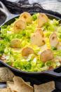 <p>Enchilada dip, but make it spooky.</p><p>Get the <strong><a href="https://www.delish.com/holiday-recipes/recipes/a49349/graveyard-chicken-enchilada-dip/" rel="nofollow noopener" target="_blank" data-ylk="slk:Graveyard Chicken Enchilada Dip recipe;elm:context_link;itc:0;sec:content-canvas" class="link ">Graveyard Chicken Enchilada Dip recipe</a></strong> from Delish. </p>