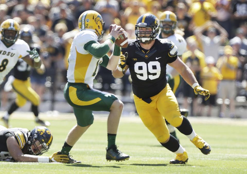 Iowa defensive lineman Nathan Bazata (99) chases North Dakota State quarterback Easton Stick during the first half of an NCAA college football game, Saturday, Sept. 17, 2016, in Iowa City, Iowa. (AP Photo/Charlie Neibergall)