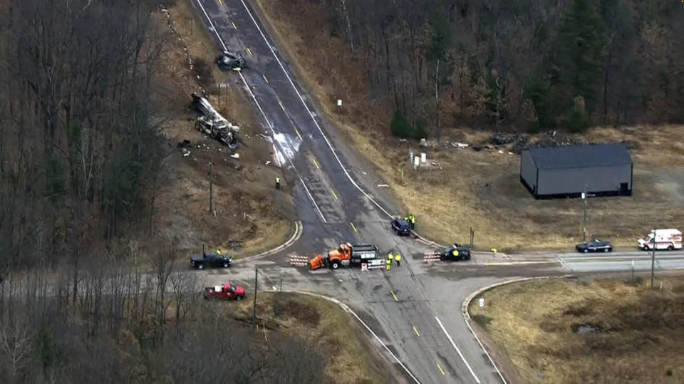 This image from video provided by KMSP-TV shows the scene of a fatal crash, Friday, March 8, 2024 in Dewhurst, Wis. Multiple people were killed in a western Wisconsin traffic crash involving a semitruck and a van, state’s governor says. (KMSP-TV via AP)
