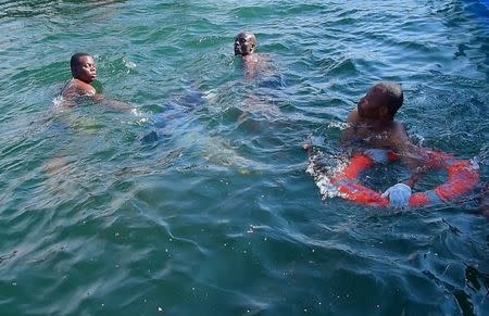 Rescuers search for bodies in the water after a ferry overturned off the shores of Ukerewe Island in Lake Victoria, Tanzania September 21, 2018. REUTERS/Stringer