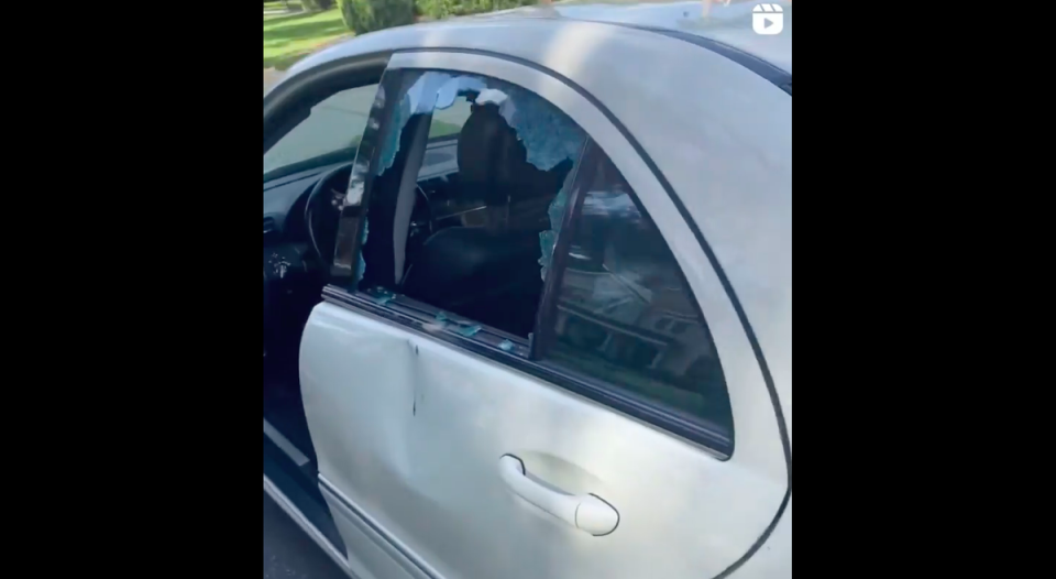 The back window of the teen’s car can be seen smashed from a rock allegedly being thrown into the backseat (Instagram/jermaine.j11)
