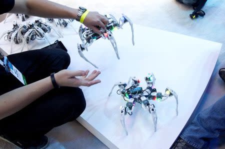 Dancing spider-like robots are displayed at the Intel booth during the 2015 International Consumer Electronics Show in Las Vegas, January 6, 2015. REUTERS/Steve Marcus