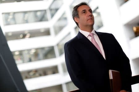 FILE PHOTO: Michael Cohen, President Donald Trump's personal attorney, looks on as his attorney (not pictured) delivers a statement to reporters after meeting with Senate Intelligence Committee staff on Capitol Hill in Washington, U.S., September 19, 2017. REUTERS/Aaron P. Bernstein/File Photo