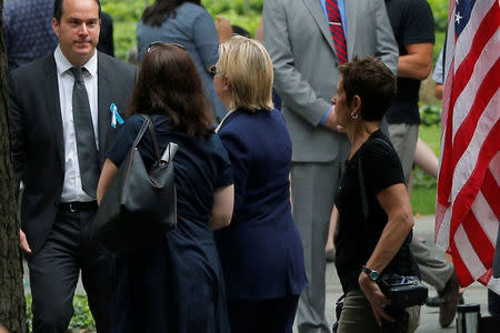 U.S. Democratic presidential candidate Hillary Clinton leaves ceremonies marking the 15th anniversary of the September 11 attacks at the National 9/11 Memorial in New York, New York, United States September 11, 2016. REUTERS/Brian Snyder