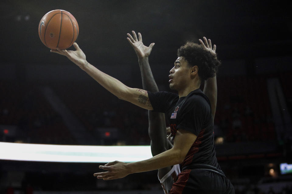 San Diego State's Trey Pulliam (4) goes for the layup against UNLV during the second half of an NCAA college basketball game on Sunday, Jan. 26, 2020, in Las Vegas. (AP Photo/Joe Buglewicz)