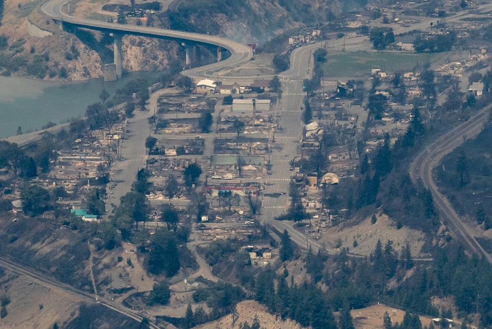 In this aerial photo taken from a helicopter, structures destroyed by a wildfire are seen in Lytton (AP)